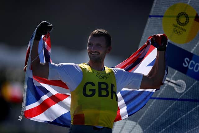 Giles Scott of Team Great Britain celebrates on the podium for the Men's Finn class on day eleven of the Tokyo 2020 Olympic Games. Photo by Clive Mason/Getty Images
