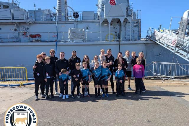 Portsdown Pumas U8 Gold and their families beside HMS Cattistock on Mother's Day
