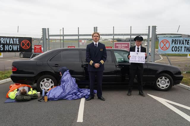Extinction Rebellion activists protest outside Farnborough Airport in Hampshire in protest against emissions from private jets. Picture date: Saturday October 2, 2021. PA Photo. See PA story ENVIRONMENT Airport. Photo credit should read: Andrew Matthews/PA Wire