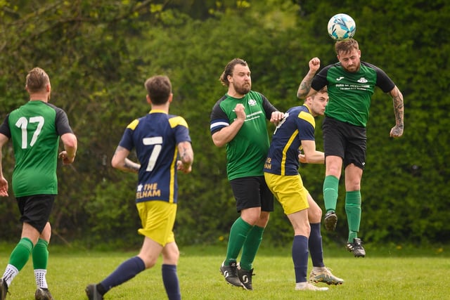 Action from Saturn Royale's 1-0 win over Pelham Arms (blue and yellow kit) in the second Adelaide Cup semi-final. Picture: Keith Woodland (300421-1099)