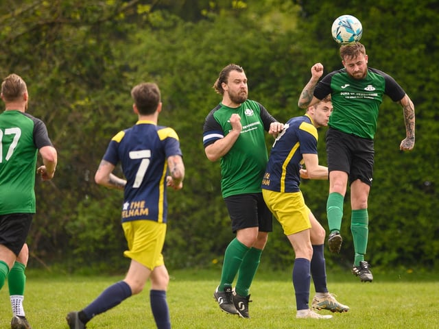 Action from Saturn Royale's 1-0 win over Pelham Arms (blue and yellow kit) in the second Adelaide Cup semi-final. Picture: Keith Woodland (300421-1099)