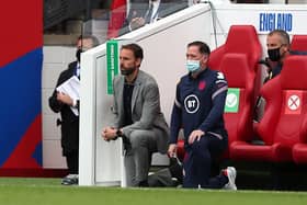 England's manager Gareth Southgate and Steve Holland, assistant coach of England take a knee ahead of the international friendly football match against Romania on June 6. Picture: Scott Heppell/pool/AFP via Getty Images