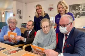 Jon Whitaker (Left) head of Hampshire and Isle of Wight Freemasons and his charity steward, John Pearson, spend time at Age Concern’s Lockswood Care and Wellbeing Centre in Locks Heath with local ladies Naomi and Mo as they reminisced using memory cards. Theresa Carter (Back Left) Head of Care looks on with Carolyn Warner the Centre’s Manager. Picture: Age Concern Hampshire.