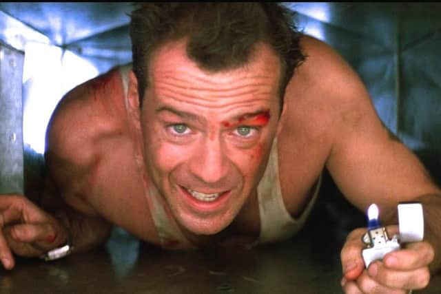 Bruce Willis as John McClane in Die Hard