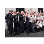 Top chefs: The team of Royal Navy cooks celebrate being crowned the best military chefs in Britain.