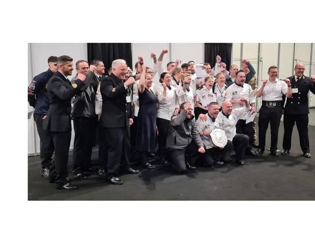 Top chefs: The team of Royal Navy cooks celebrate being crowned the best military chefs in Britain.