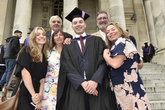 University of Portsmouth students graduating from business, leadership and human resource management at Portsmouth Guildhall on Monday, July 24. 
Pictured is: Ben Withers wih his family.

Picture: Sarah Standing (240723-6992)