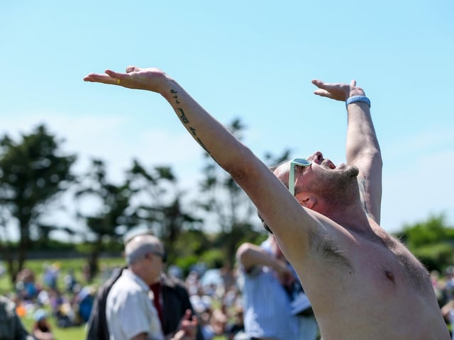 Salute to the sun at the Live at the Bandstand music event, Castle Field, Southsea. Picture: Chris Moorhouse (250524-19)