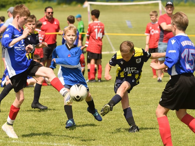 Action from the Clanfield youth football tournament at Horndean Technology College. Picture: Keith Woodland (270521-592)