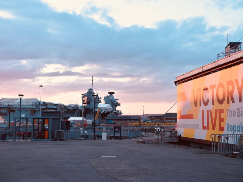 The D-Day beacon lighting was set against a backdrop of HMS Prince of Wales which is currently in her home port of Portsmouth