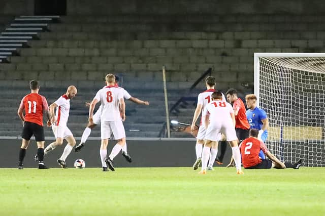 Tom Jeffes about to score Horndean's stoppage-time leveller. Picture by Ken Walker