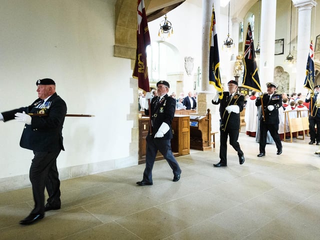 Pictured is: The Standards being marched out of the Cathedral. Picture: Keith Woodland (190621-513).