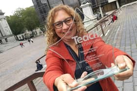 Cllr Suzy Horton holding one of the Teach Portsmouth Awards