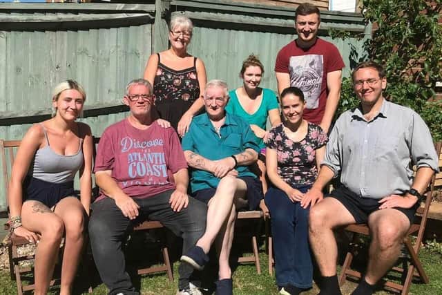 Sophie and Jack Burgess (back row, middle and right) with the rest of their family
