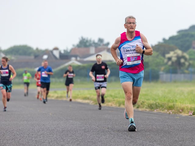 Approaching the finish line at the Run the Runway event at Solent Airport. 

Picture: Mike Cooter