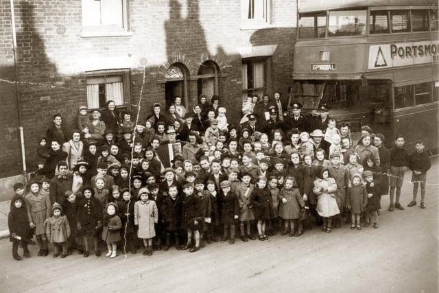 Residents gather in Buckland, Portsmouth, around 1947 with 'Bunky Doo-dalee-do' starring on accordion, real name Alfred Nicholson. The image was taken in 1945 in Sultan Road. Picture: Courtesy of Brian Duke