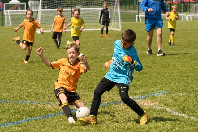 Action from the Clanfield youth football tournament at Horndean Technology College. Picture: Keith Woodland (270521-869)