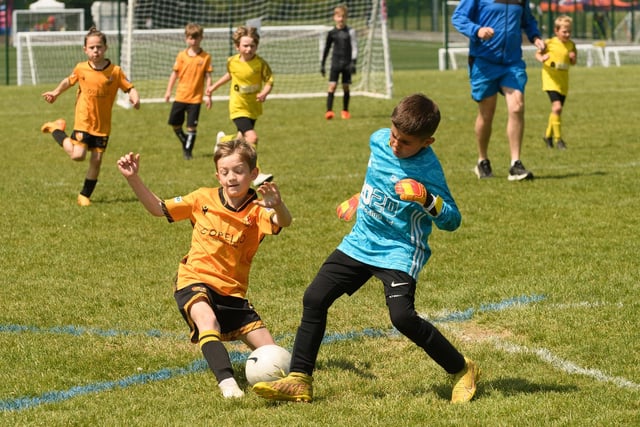 Action from the Clanfield youth football tournament at Horndean Technology College. Picture: Keith Woodland (270521-869)
