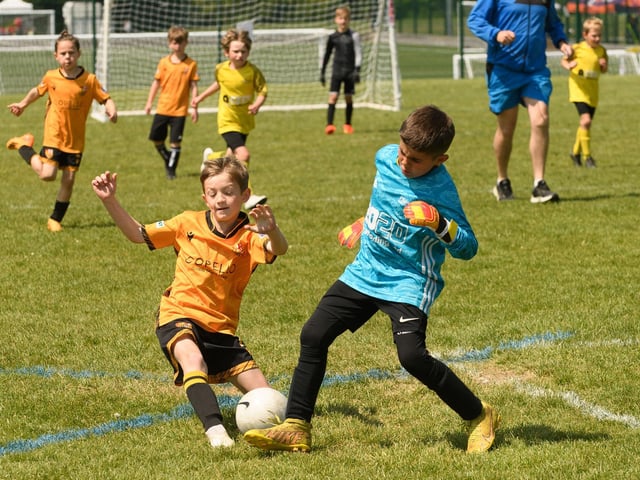Action from the Clanfield youth football tournament at Horndean Technology College. Picture: Keith Woodland (270521-869)