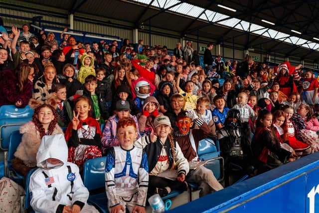 Children celebrating World Book Day at Fratton Park