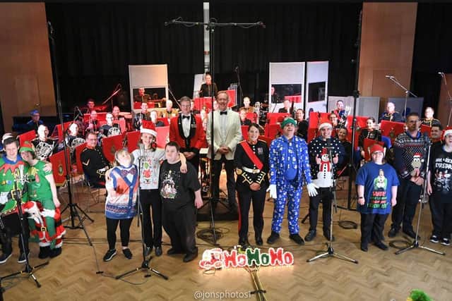 Music Man Project performers pose with the Royal Marine musicians.