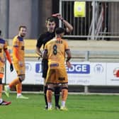 Billy Clifford is shown the red card after his second bookable offence at Dartford. Picture: Kieron Louloudis.