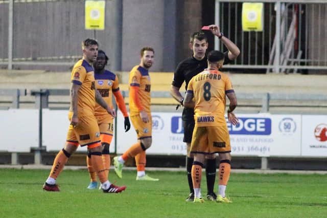 Billy Clifford is shown the red card after his second bookable offence at Dartford. Picture: Kieron Louloudis.