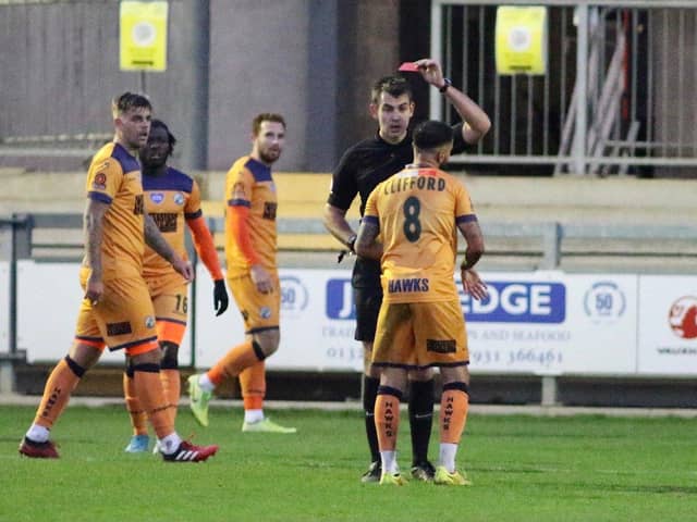 Billy Clifford is shown the red card after his second bookable offence at Dartford. Picture: Kieron Louloudis.