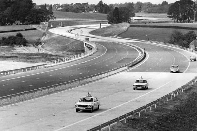 A couple police cars drive up the empty M27 in September 1975 Picture: The News PP4966