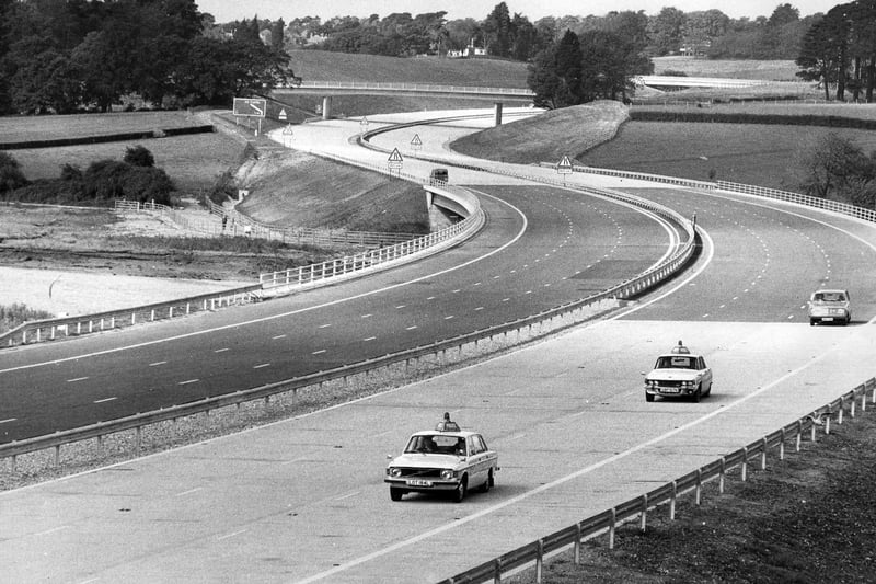 A couple police cars drive up the empty M27 in September 1975 Picture: The News PP4966