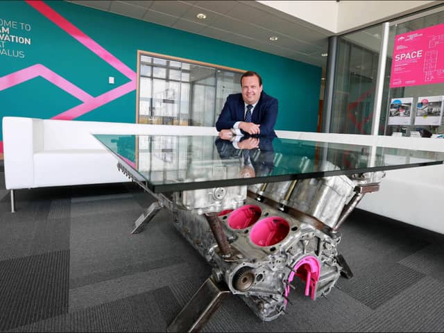 Centre Director Stephen Brownlie is pictured with a glass-top coffee table fashioned from a V-12 engine from a Second World War Supermarine Spitfire.