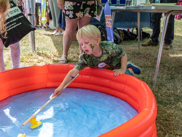 Harvey Spittle (4) captures a duck in one of the many children's activities present at the Party in the Warren. Picture: Mike Cooter (080723)