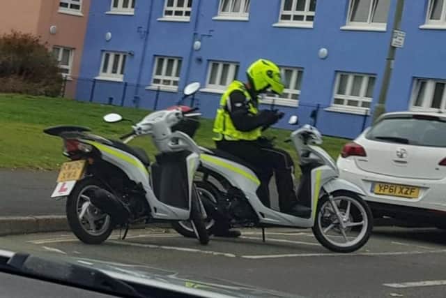 An NSL civil enforcement officer issuing a parking ticket in Gosport. 