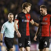 Sean Raggett is enjoying playing alongside skipper Clark Robertson in Pompey's defence. Picture: Daniel Chesterton/phcimages.com