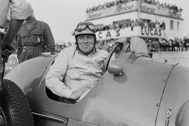 19th April 1954:  British motor racing driver Reg Parnell (1911 - 1964) in his Ferrari at an international race meeting at Goodwood.  (Photo by Central Press/Getty Images)