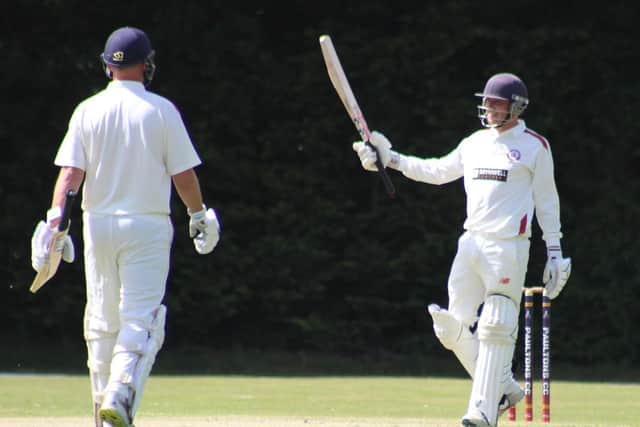 Tom Benfield celebrates  his 50 for Portsmouth & Southsea against Paultons. Picture by Tim Rogers