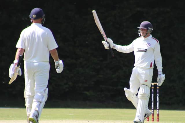 Tom Benfield celebrates his 50 for Portsmouth & Southsea against Paultons. Picture by Tim Rogers