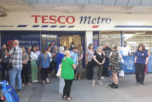 Staff received a round of applause as they left the Leigh Park Tesco Metro for the final time. Picture: Pete Martin