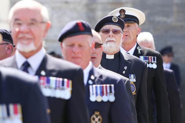 Veterans pictured marching by the Falkland Memorial Stone, Square Tower, Old Portsmouth 
Photo: Habibur Rahman