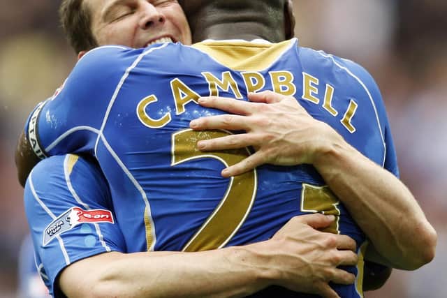 Sol Campbell and David Nugent embrace after Pompey's FA Cup final victory over Cardiff in May 2008. Picture: AFP PHOTO/Adrian Dennis