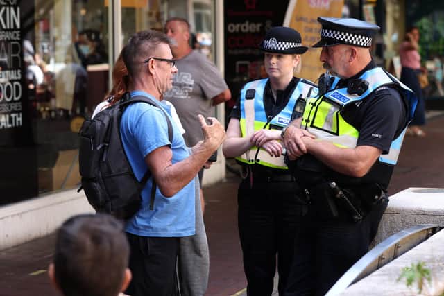 A Drag Queen hosting a children's story time at Southsea Library. Pictured are protests for and against it outside.

Picture: Sam Stephenson.