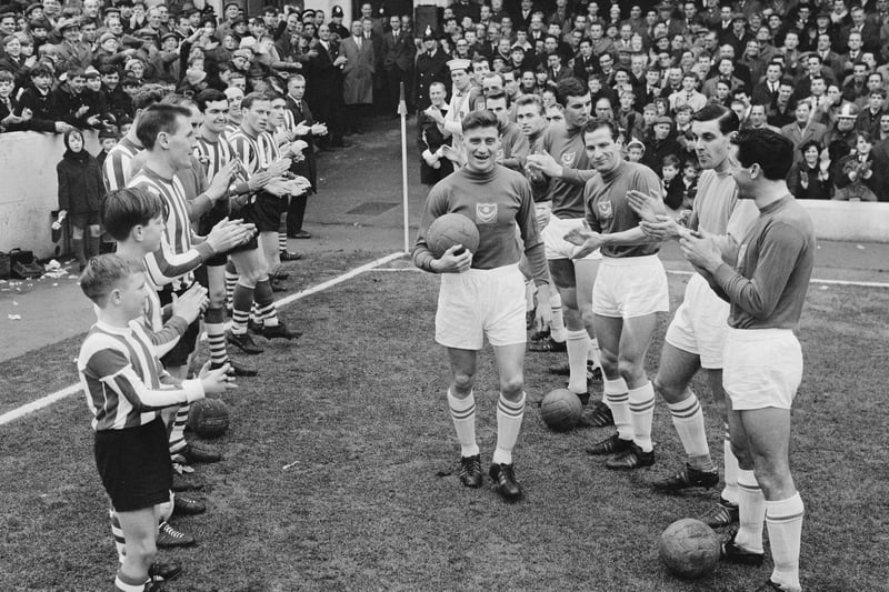Soccer players from Southampton FC and Portsmouth FC enter the field before a match, UK, 16th January 1965. (Photo by Daily Express/Hulton Archive/Getty Images)