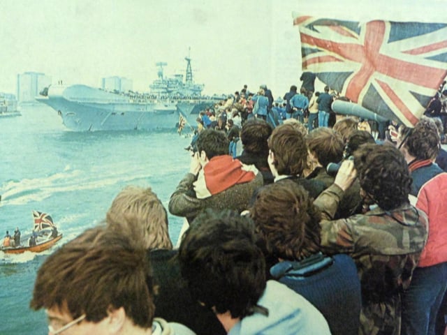 HMS Hermes leaves Portsmouth Harbour, bound for the Falklands, and cheered on her way by a flag-waving crowd