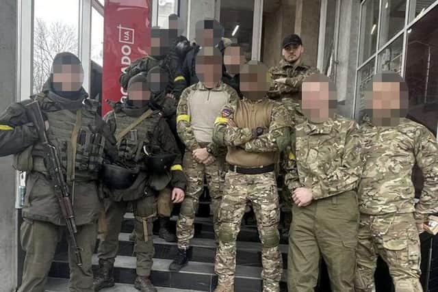 Ethan Dennis with his squad in Lviv
