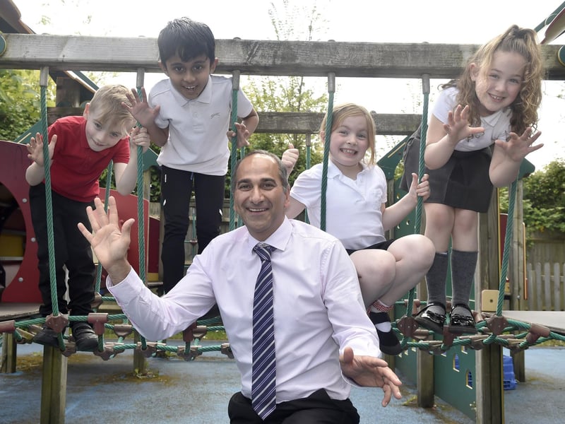 Portsdown Primary School in Cosham, has retained a Good Ofsted report.Pictured is: (middle) Headteacher Ash Vaghela with (l-r) Teddy Wright (7), Kasinadh Lineesh (7), Melody Taylor (8) and Bridie Hayward (7).Picture: Sarah Standing (070524-1939)
