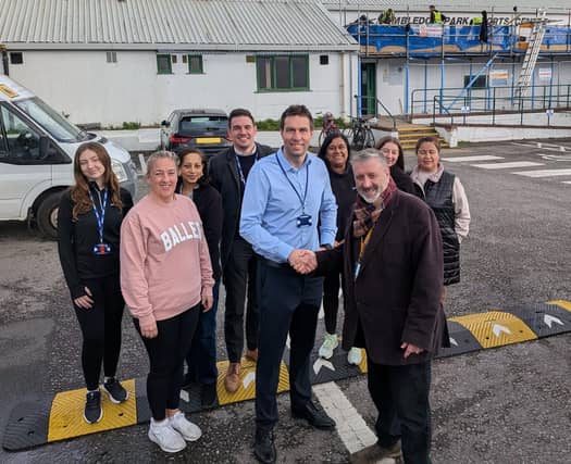 Cllr Lee Hunt (3rd from right) with Rob Cunningham, Director of Leisure & Business Development at BH Live (5th from right), Matt Low, Portsmouth Cluster Manager at BH Live (4th from left), and Debbie Laycock, leader of the Walking Netball group and Mums & Tots Netball Fitness (2nd from left), accompanied by BH Live staff and members of the Chat over Chai Badminton Group, outside Wimbledon Park Sports Centre. The future of the centre has now been secured for the next 10 years.