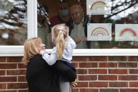 Children from Growing Places nurseries visited their friends at local nursing homes to give them gifts just before lockdown. Pictured: Wendy Fenn and Hope Goodson saying hello to Les