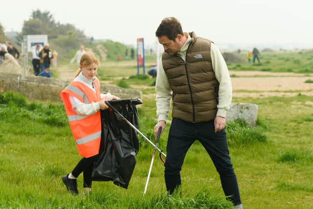 Pictured is: Stephen Morgan joined in the beach clean.
Picture: Keith Woodland (220421-14)