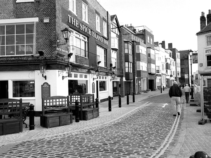 Cobbled streets back in 1999 - The Spice Island Inn pub (left), at Bath Square, The Point, Old Portsmouth, which are often in danger of flooding during exceptional high tides. Picture: Mike Scaddan. 995175-3