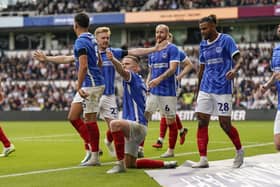 Colby Bishop celebrates Pompey's late Derby goal